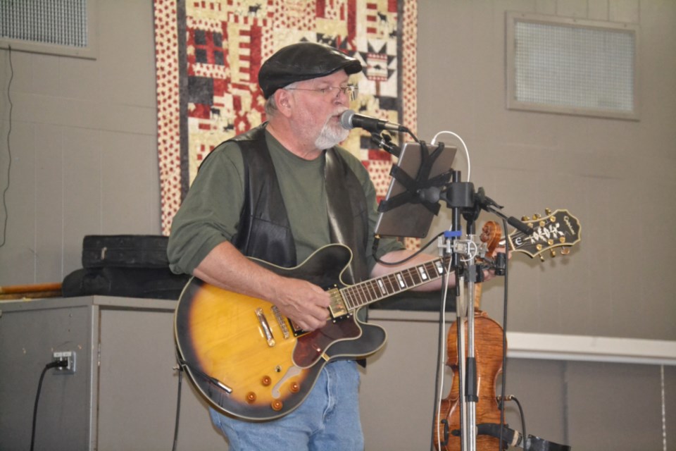 Lyle Baldwin sings some country classics during the first Music in the Park event of the summer on July 6. The concert was held in the Legion Hall due to bad weather.
