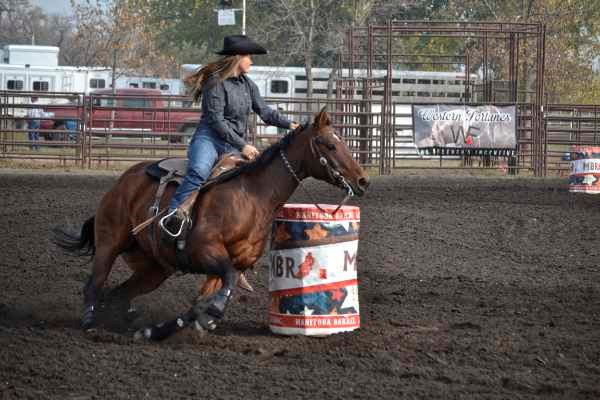 Contestant Leah Obach of Kenton rounds a barrel during her run in the open section of the Manitoba Barrel Racing Association Fall Event in Virden on October 2.