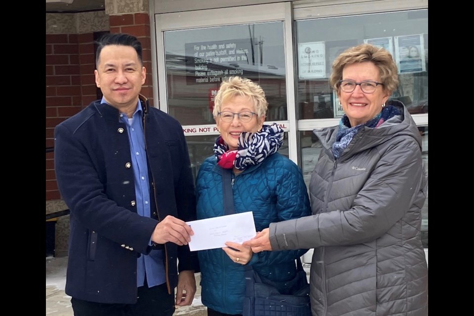 Leandro Ilagan presents Virden and District Health Auxiliary president Marilyn Carruthers and treasurer Gwen Clarke with a cheque for $10,000 in memory of his wife Theresa who began her nursing career in Virden.