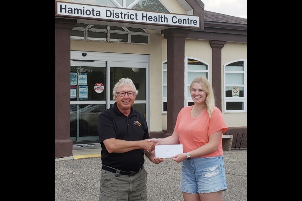 The Hamiota District Health Centre Foundation Inc. is pleased to be able to support students who were originally from the Hamiota Health Centre Catchment Area and who are in their 4th or 5th year of studies in the medical field. The 2023 Bursary Recipients each received a cheque in the amount of $2,000. 

Vaughn Wilson, foundation administrator, presenting to Kara Kent of Hamiota. Kara is currently enrolled in the Bachelor of Nursing program at the University of Regina.