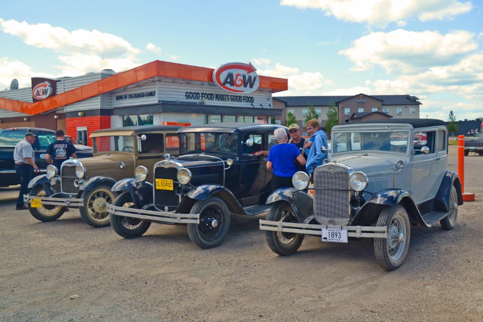 Vintage vehicles taking part in the Pine to Prairie Relic Run sit outside the Virden A & W Restaurant on the Trans-Canada Highway service road on the final day of the run July 5. The cars attracted interest in the parking lot while the drivers enjoyed a lunch break before continuing on to the Manitoba Antique Automobile Museum in Elkhorn.  