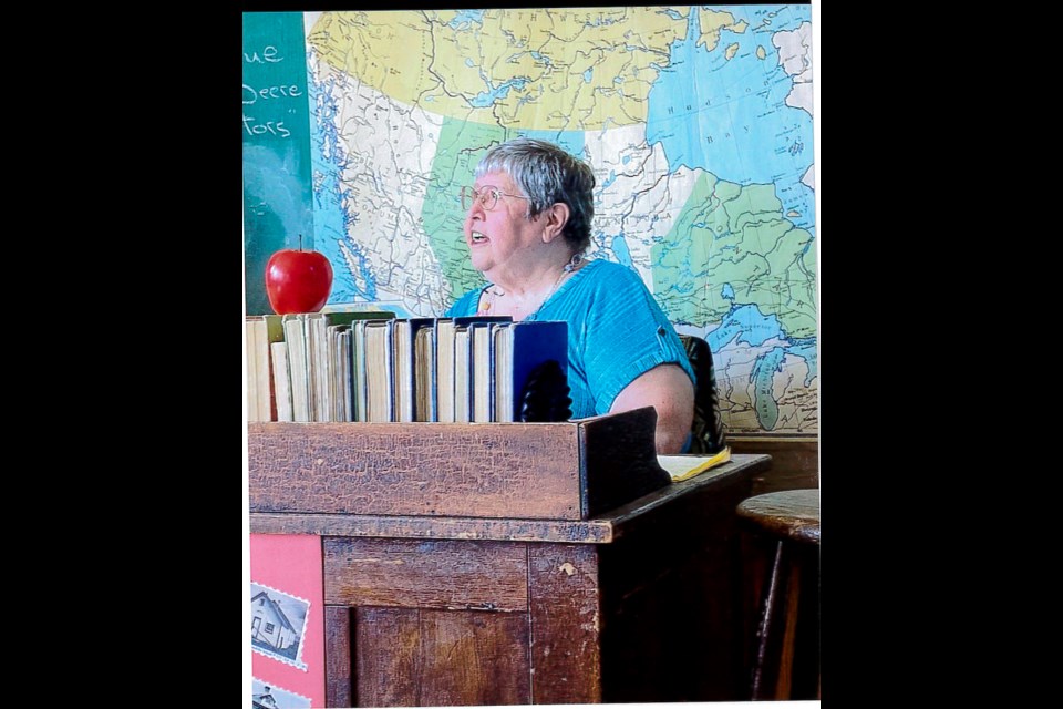  Lorraine Scott at the teacher’s desk. Notice the apple.