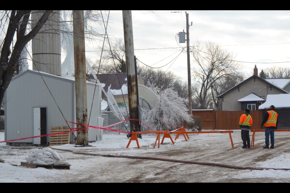  Town of Virden utility staff assess the situation in preparation for repairs after a leak occurred in the water tower during the last week of October. 