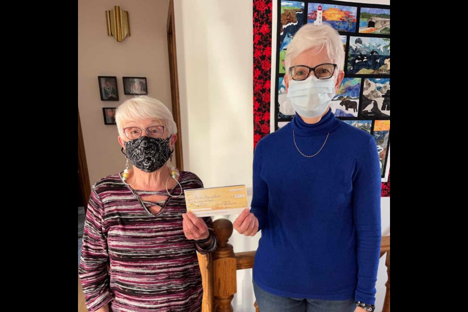 
For the Guild Zarn presents a cheque for $500 to Sharon Elliott, Activities Director at Willow View Personal Care Home for their Activities Department.