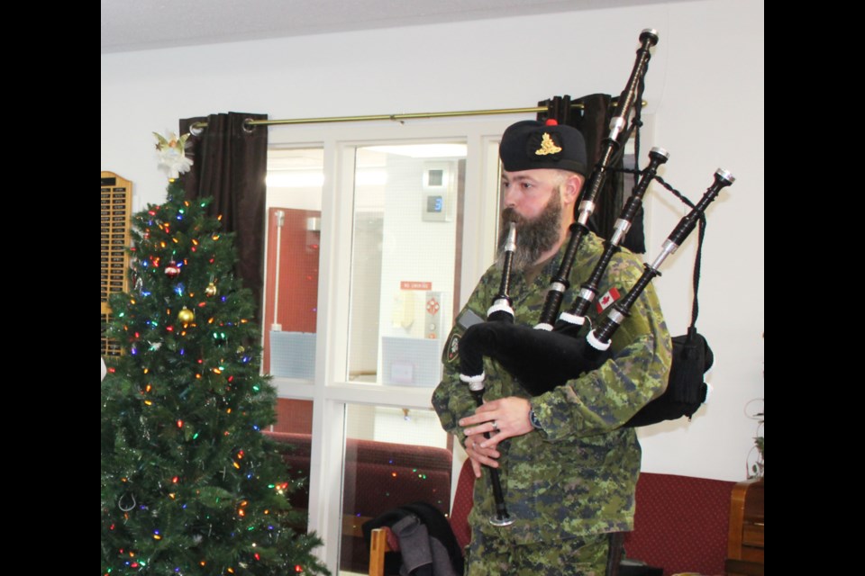 Scottish piper, Robert MacKay is a hit as he strikes up Happy Birthday in Princess Lodge on Dec. 6. MacKay has been playing for 22 years and serves as a gunner in the 1RCHA.