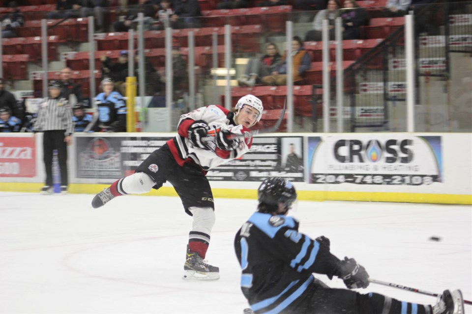 Oil Caps player fires the puck in a home game in TOGP against the Winnipeg Blues. 