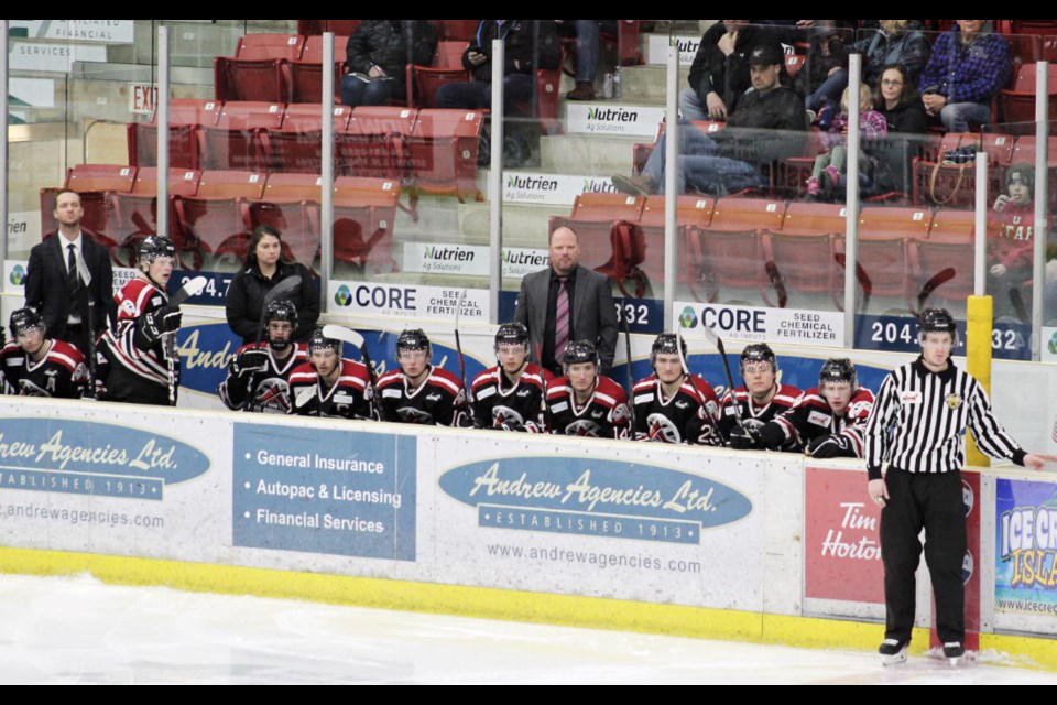 Oil Capitals Coach Tyson Ramsey on the bench (standing, right) named MJHL Coach of the Year.