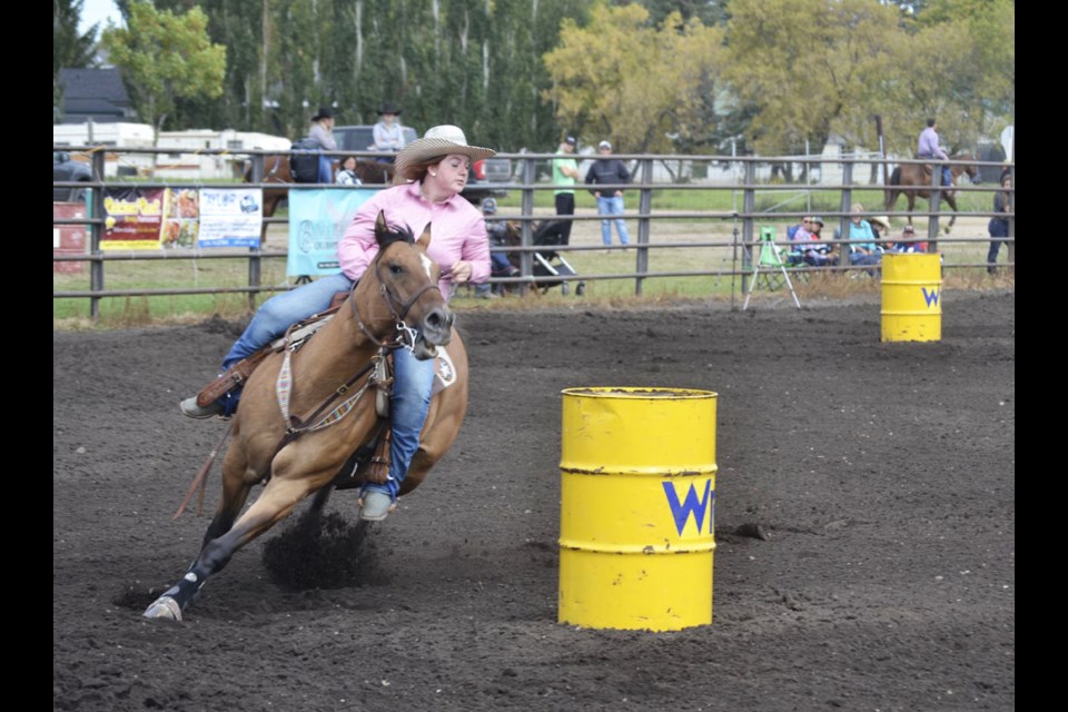 Ricki Hill competes in the Youth category of the "Don't Give a Buck" barrel racing jackpot at the Virden outdoor rodeo arena on Sept. 12. 