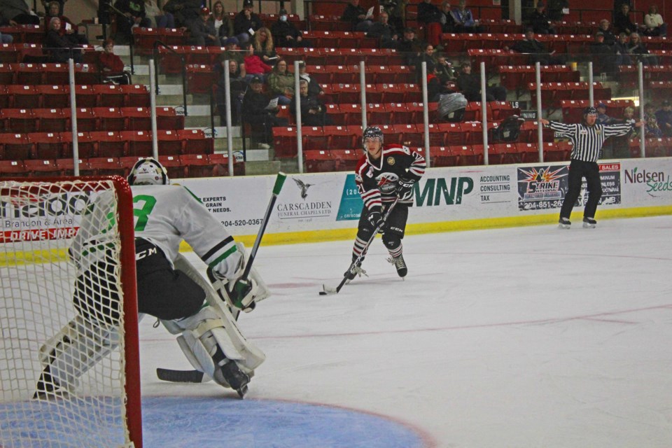 Oil Caps #21 Andrew Blocker cuts for the Portage net in Monday night's final pre-season game.