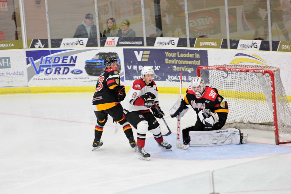 Oil Caps forward #6 Luke Robson puts pressure on the Wayway net.