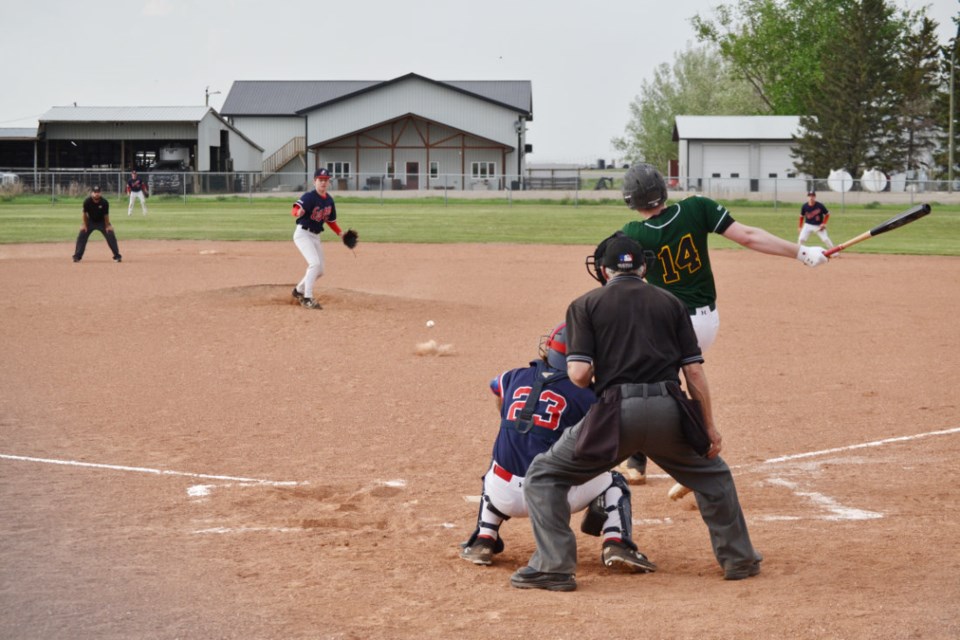 Erik Sigurdson, pitcher for the Virden Oilers, connects in the top half of the third inning, driving home #37 Jeff Peel in their first game of the 2023 South West Baseball League season on May 26.