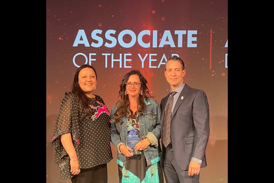 Accepting the Store of the Year award in early 2022, SVDN Petro-Canada Assistant Manager Melissa Tacan and General Manager Helena Mazawasicuna with Suncor Senior Manager Kevin Krystik