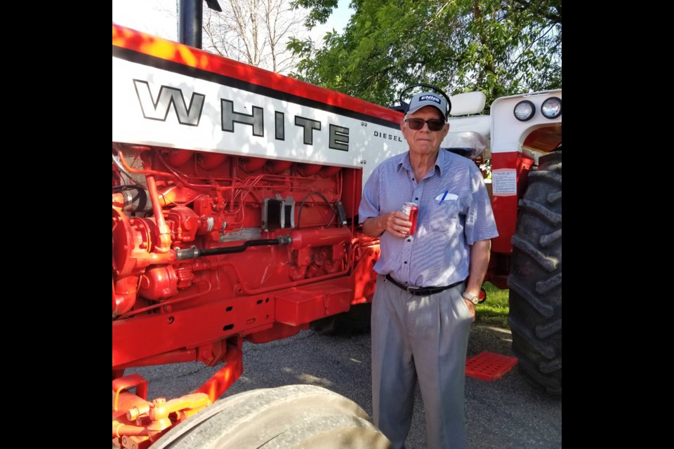 At the Hamiota Show’n Shine held on the eve of the town’s July fair, Wilson beside his White tractor. 