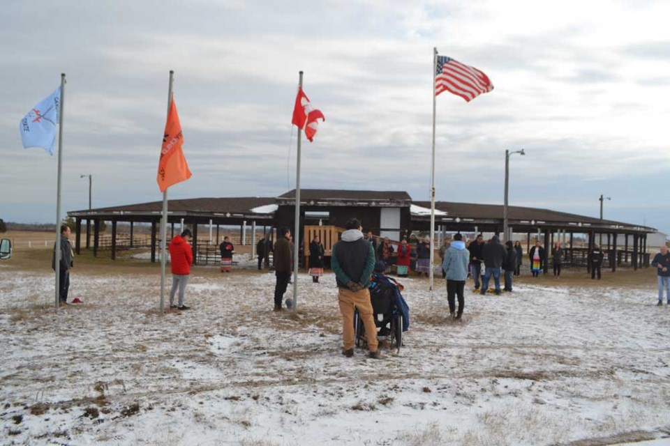  Members of the Canupawakpa Dakota Nation community gather for a flag-raising ceremony on the reserve during a service to mark National Indigenous Veterans Day on November 8.