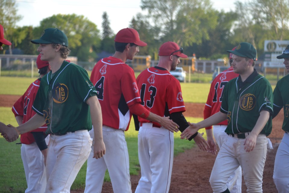 Virden Oilers and Hamiota Red Sox players shake hands at the conclusion of the regular season game on Friday, June 10.  The Oilers defeated the Red Sox 4 to 2