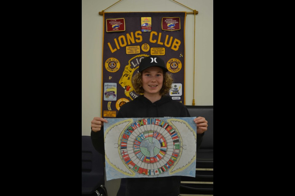 Carson James, winner of the 2021 Lions International Peace Poster Contest, displays his entry. 