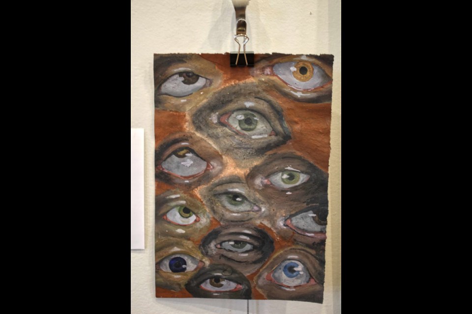 “Eyes”, a watercolour by L. Pederson, Gr. 10 The walls of the gallery showcase interesting student ideas and talent.