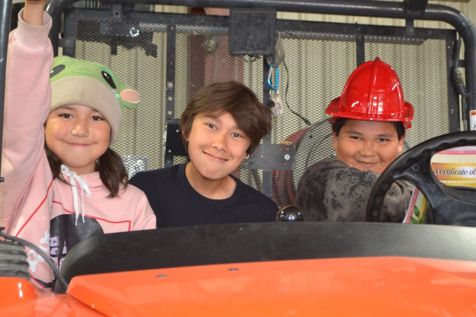 Future firefighters? Students pose for a photo in the Wallace District Fire Department's all-terrain vehicle.