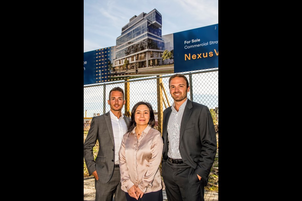 Rachel Lei, managing director and CEO of Keltic Canada Developments, is flanked by Avison Young agents Jake Luft (L) and Mitchell Knoepfel at the site of the Nexus strata office tower in the False Creek Flats. | Chung Chow 