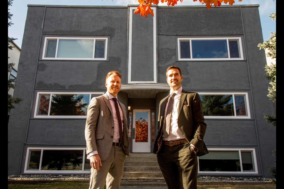 James Blair (L) and Patrick McEvay, multi-family specialists with Marcus & Millichap, Vancouver: the renovated older apartment building on Cambie Street behind them is listed at approximately $660,000 per door.|Chung Chow 

