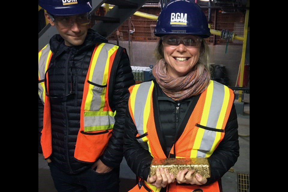 Barkerville Gold Mine geologist Maggie Layman holds a gold brick worth about $967,000. The brick was produced from the Bonanza Ledge underground mine on Barkerville Mountain. |Barkerville Gold Mines 