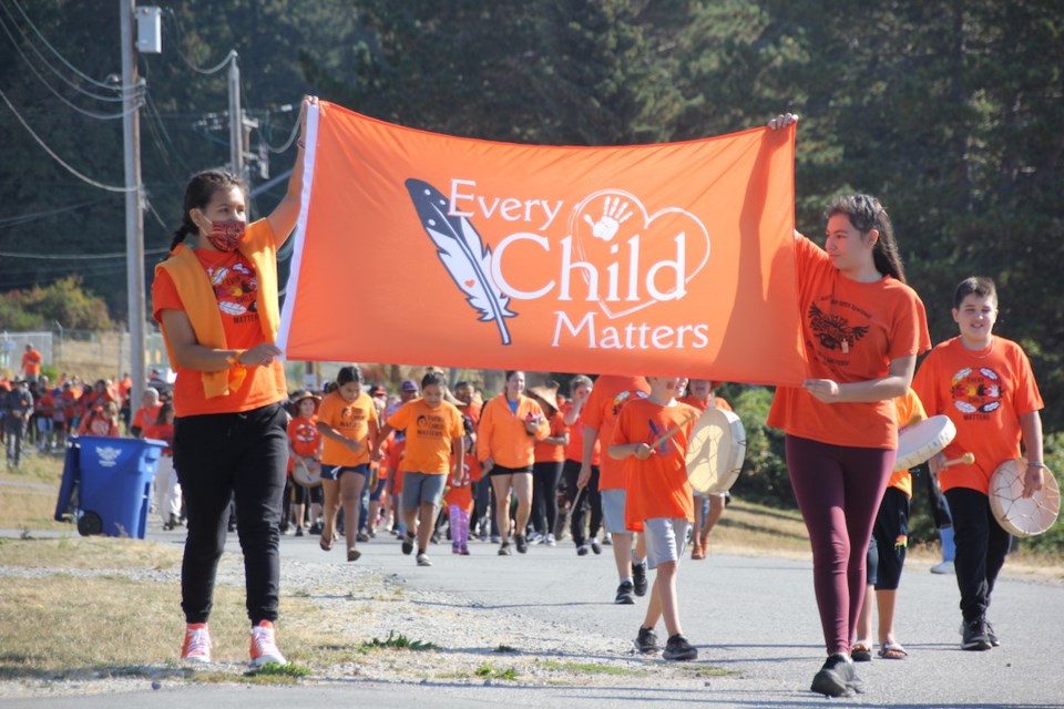 A parade of orange stretched along the oceanfront and back toward Grieving Mother monument on the shíshálh Nation, District of Sechelt.| Reil Bartlett, Coast Reporter