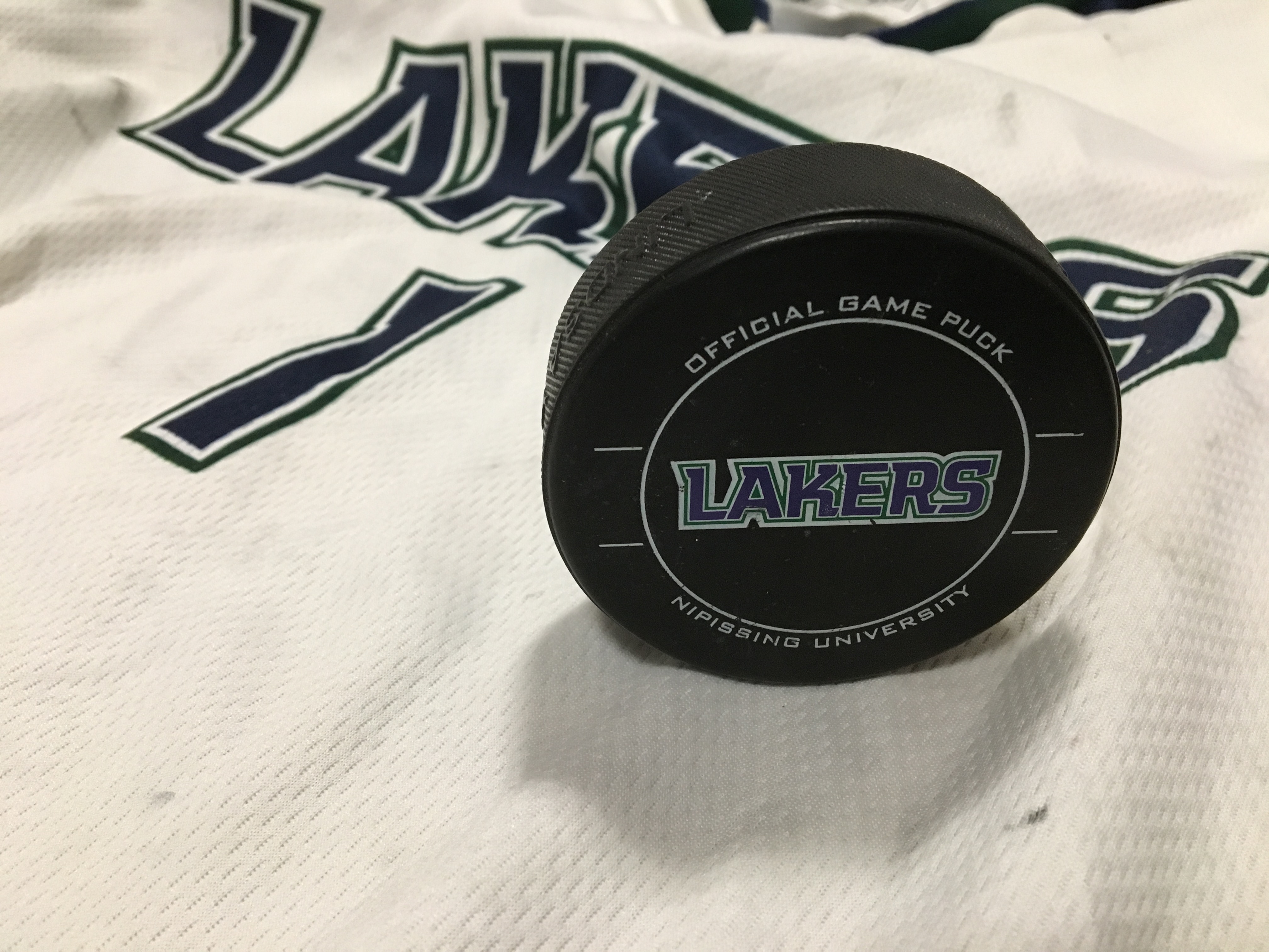 Two losses for Lakers' hockey teams