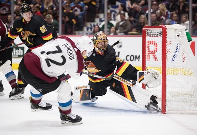 MacKinnon scores OT winner, Avs recover from blowing late lead to beat Canucks